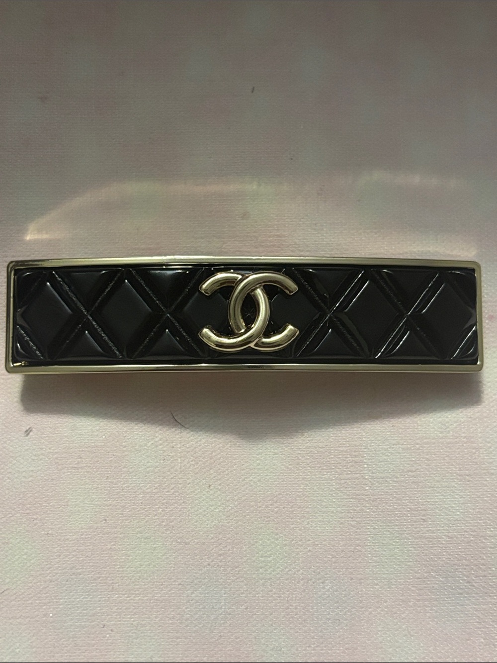 CHANEL Black Quilted Logo Hair Barrette with Gold-Tone Trim